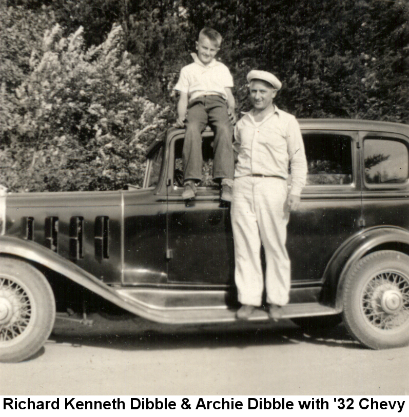 Black and white photo of Richard Kenneth Dibble, about 10 years old, sitting on the roof of a black four-door 1932 Chevy, with Archie Dibble standing on the running board beside him.